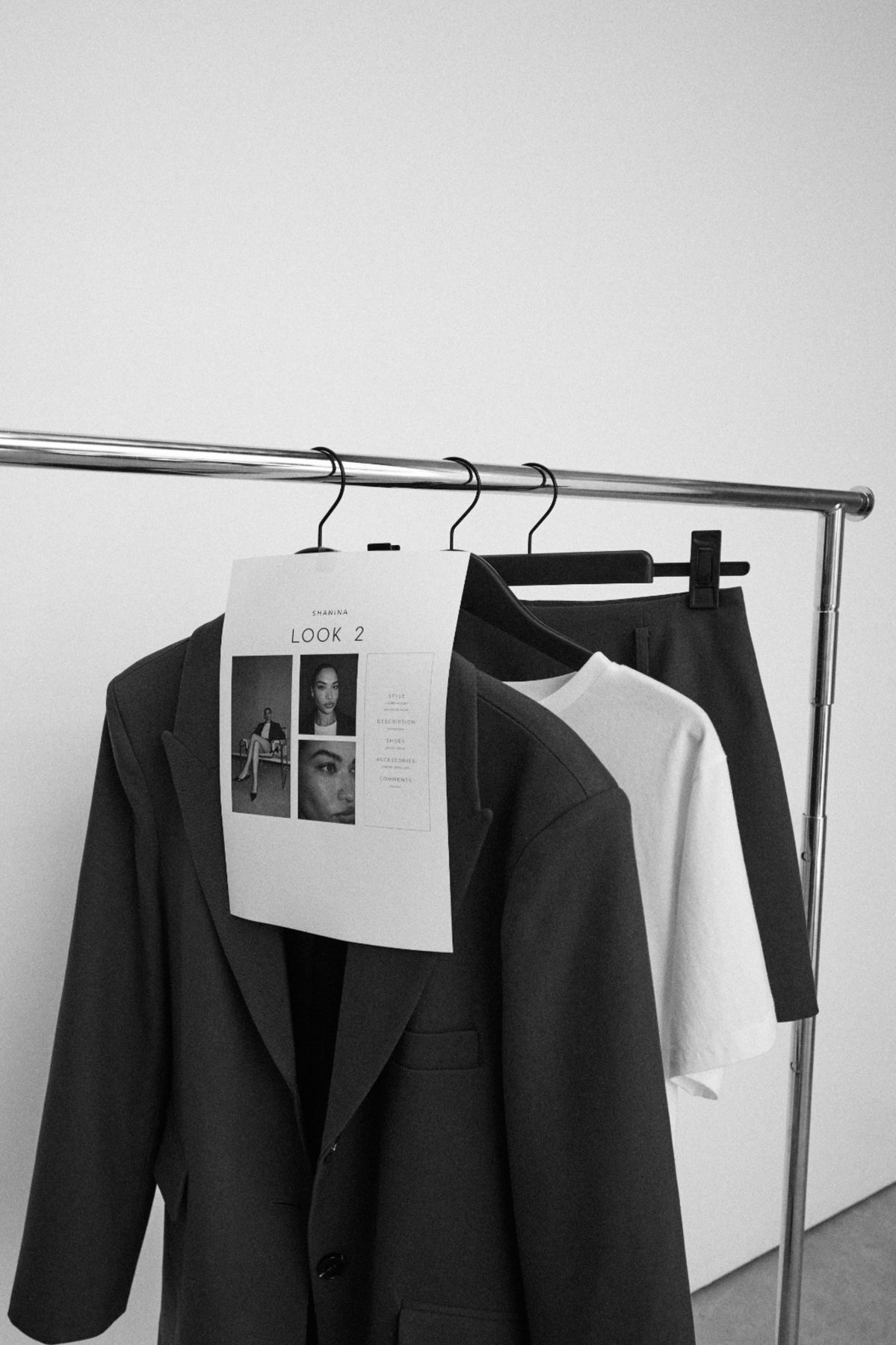 Wardrobe rack with styled outfit plan